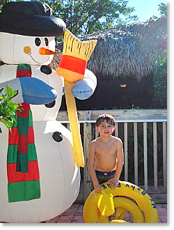 Aiden with snowman in Florida