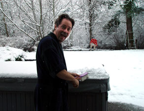 Chuck cleaning snow off hot tub