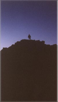 Mike Ricciardi climbing a mountain